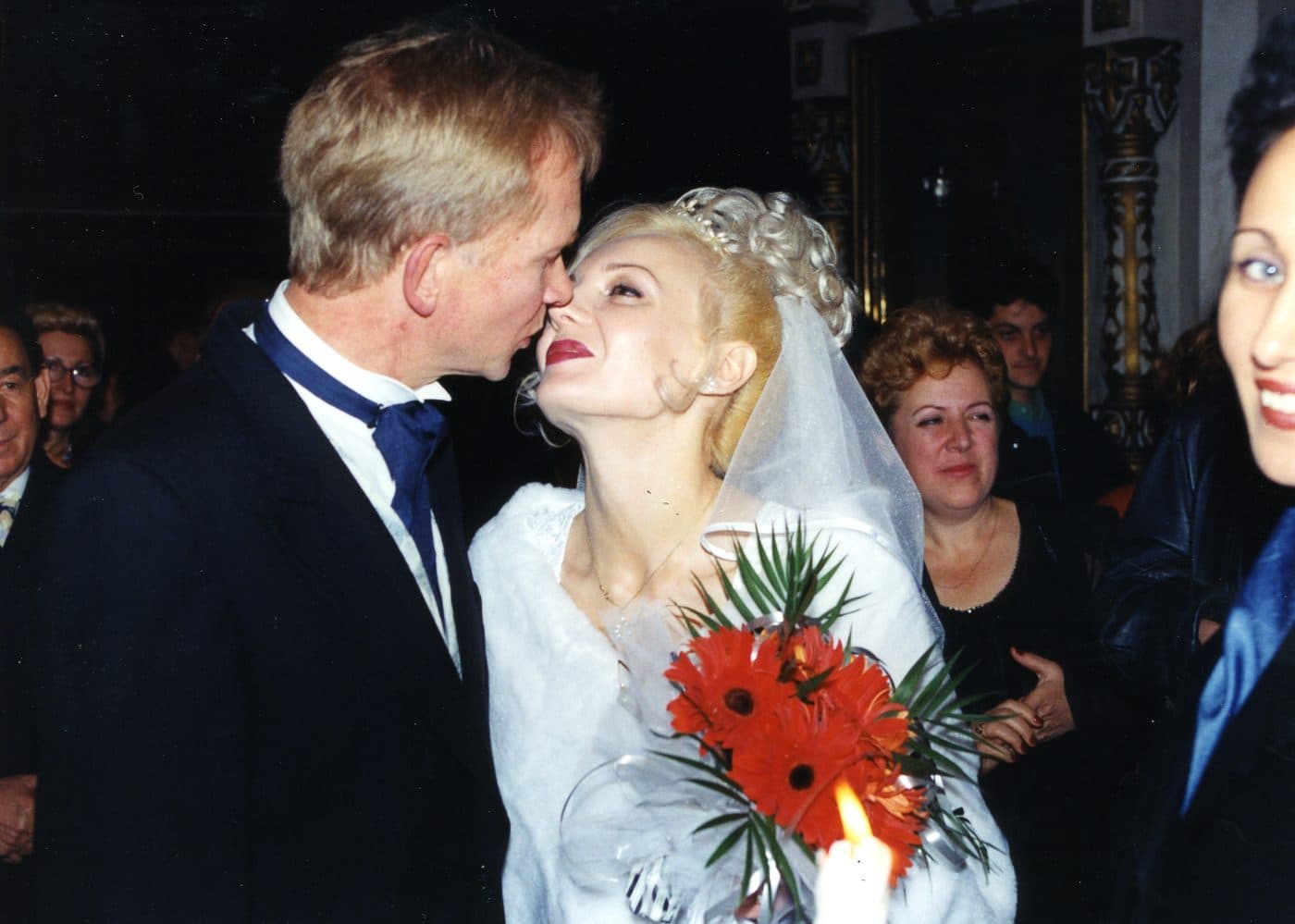 Andrew kissing Mady on their wedding day